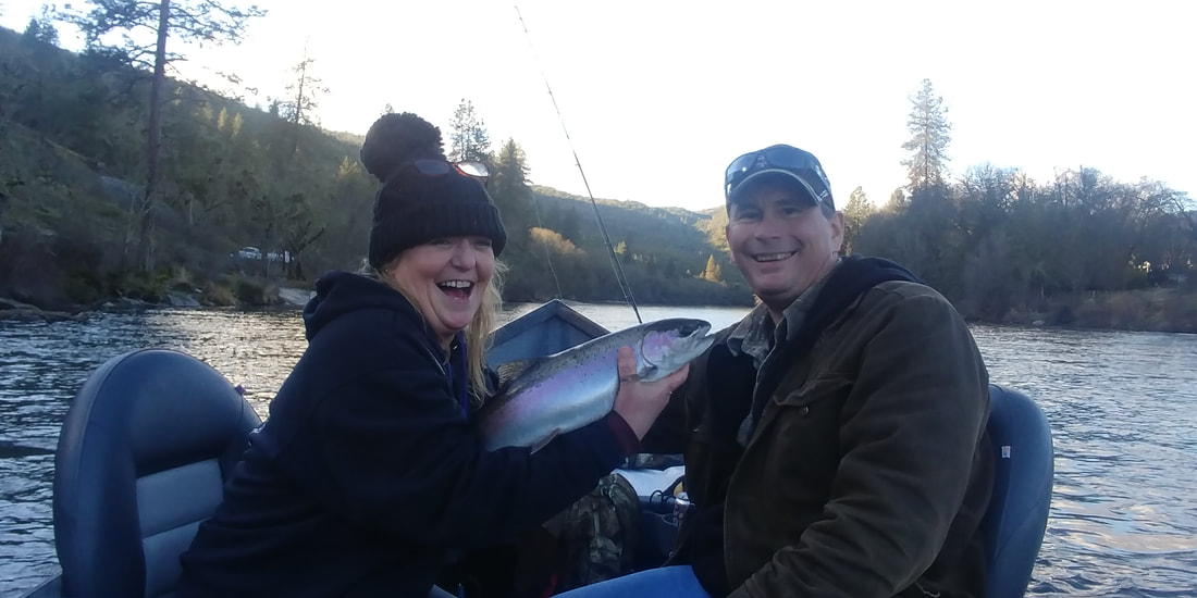 Happy couple on a winter fishing charter.